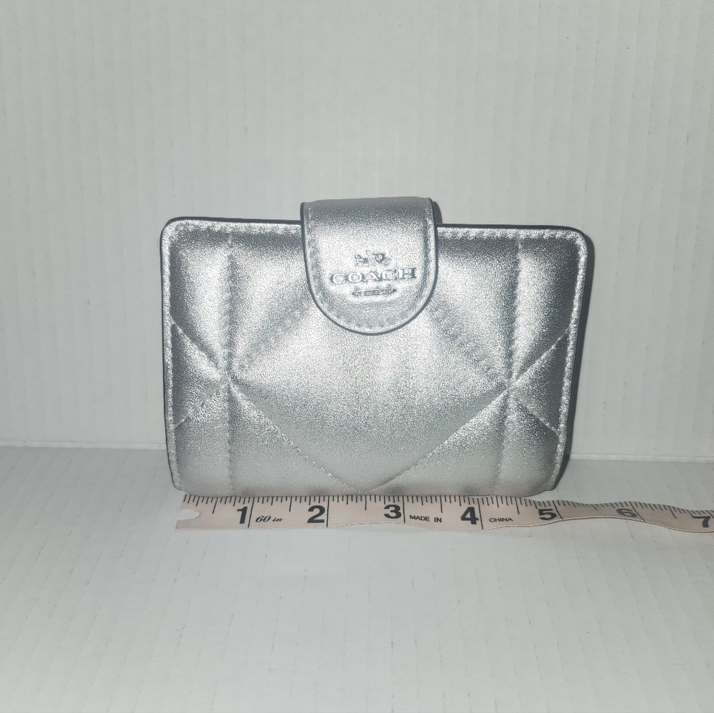 Coach Medium Corner Zip Wallet With Puffy Diamond Quilting in Metallic Silver.